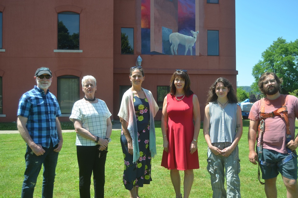 Representatives from CRCF, the Tri-County Arts Council and mural artists and project managers gather at the site of the Heart of Olean Mural Project. From left to right: Mikel Wintermantel, former Tri-County Arts Council Executive Director, Wendy Brand, CRCF board member and grant allocations committee member, Paula Bernstein, Tri-County Arts Council executive director, Karen Niemic Buchheit, CRCF Executive Director, Ella McCausland, an artist and project manager from Saligman's studio and Alex Derwick, an Olean native mural artist.